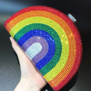 Macro shot of D-shaped evening clutch bag with sparkling rainbow rhinestone gradient detail