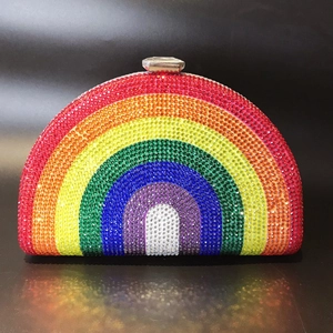 Macro detail of rainbow rhinestone encrusted evening bag with sparkling crystal closure