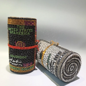 Macro detail of cylinder evening bags with luxury dollar pattern and colorful rhinestones