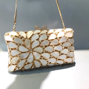 Water-drop shell dinner clutch bag with hollow out diamond accents and gold chain strap