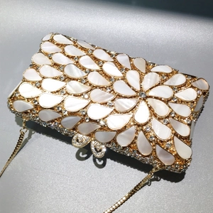Elegant shell petal dinner clutch with teardrop pearls and crystals on gold frame