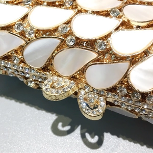 Teardrop shell evening clutch bag with gold frame and sparkling crystals for women