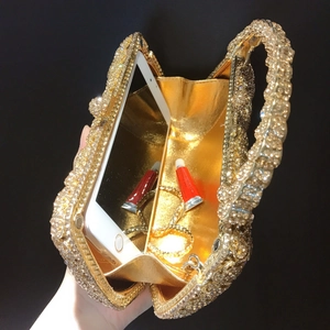 Golden rhinestone evening clutch bag with metal handle and chain for dinner party