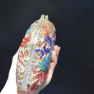 Luxurious oval evening clutch bag with colorful rhinestones and floral pattern
