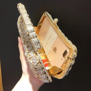 Luxury rhinestone clutch bag interior showing space for a smartphone and lipstick
