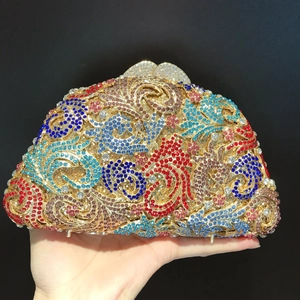 Close-up of colorful rhinestones and floral metal patterns on this luxury evening clutch