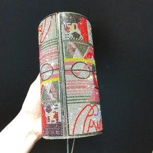 Sparkling cylinder clutch bag with colorful rhinestones and luxury diamond chain strap