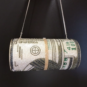 Close-up of sparkling colorful rhinestone dollar cylinder clutch bag with chain strap
