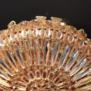 Champagne gold evening clutch with radiating rhinestones and crystals on a shell frame