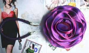 Detail of purple silk rose ornament and matching woven lanyard with metal closures
