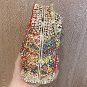 Close-up of vibrant multi-colored crystal rhinestones on elephant evening clutch bag