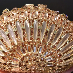 Luxe rose gold shell evening clutch with shimmering rhinestones and large crystals
