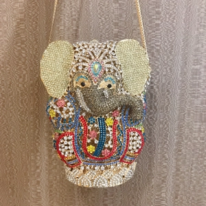 Detailed close-up of a colorful elephant evening clutch with handset crystal rhinestones