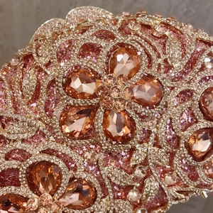 Elegant floral rhinestone clutch bag with amber crystals and sparkling diamond accents