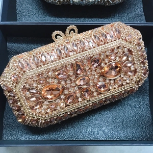 Champagne gold luxury evening clutch with crystal floral patterns and metal chain