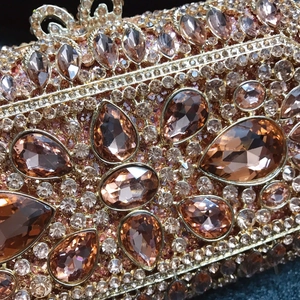 Luxury champagne gold dinner clutch bag with sparkling rhinestone and crystal embellishments