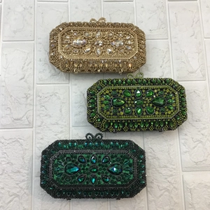 Detailed view of luxury evening clutch bags with sparkling rhinestones and floral crystals