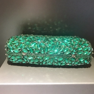 Elegant emerald crystal clutch bag with rectangular metal frame and evening rhinestones