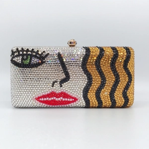 Artistic rectangular crystal evening clutch with abstract rhinestone face and red lips