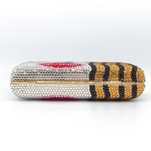 Sparkling crystal evening clutch bag in capsule shape with tiger print and red lip patterns