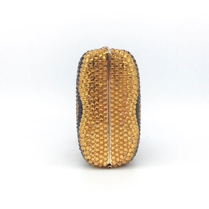 Elegant crystal evening clutch with amber and black rhinestones in a gold metal frame