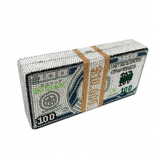 Detailed close-up of a luxury dollar stack clutch bag with sparkling crystal rhinestones