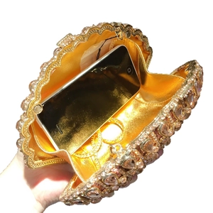 Sparkling shell evening bag with champagne rhinestones and chain shown with phone storage