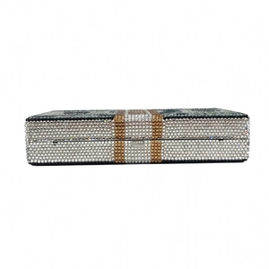 Macro shot of luxury crystal-encrusted dollar clutch showing detailed silver rhinestones