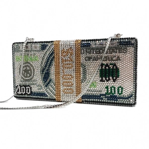 Macro detail of dollar stack clutch bag featuring crystals and detachable chain