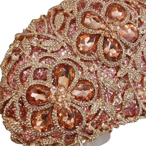 Luxury rose gold evening clutch bag with amber floral gemstone inlay and crystals