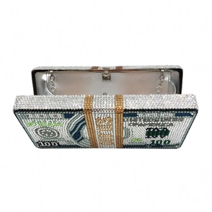 Detailed close-up of a luxury dollar stack clutch bag with sparkling crystal rhinestones