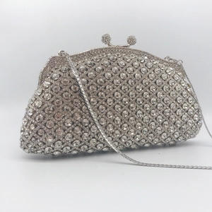 Elegant silver clutch bag with sparkling rhinestones and a metal chain strap for parties