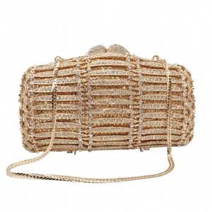 Detail of luxury gold cylindrical evening bag with rhinestones and snake chain strap