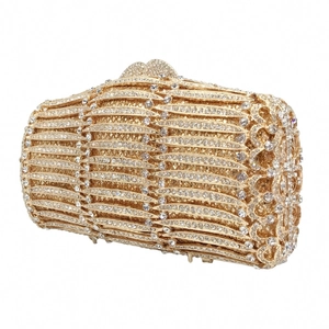 Detailed view of luxury gold evening clutch with hollow metal shell and premium rhinestones