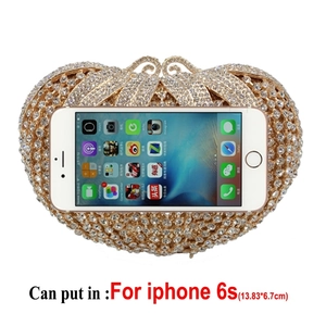 Size comparison of luxury hollow out rhinestone tomato clutch with an iPhone 6s