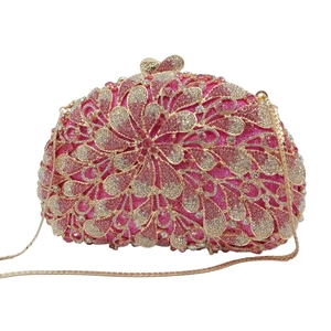 Luxurious pink rhinestone evening clutch featuring a floral hollow shell design and gold chain