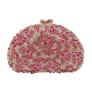 Macro detail of luxury rose pink evening clutch with sparkling floral rhinestone patterns