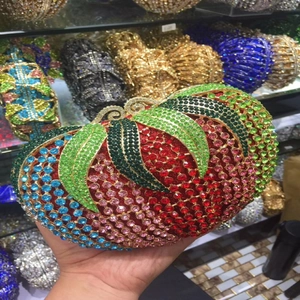 Macro detail of luxury evening clutch bag with colorful rhinestones in floral leaf pattern
