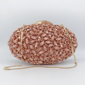 Elegant rose gold oval evening clutch bag with sparkling marquise crystals and chain strap