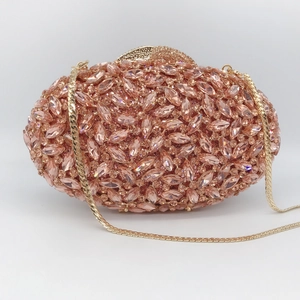 Pink rhinestone evening clutch with gold chain and marquise crystal embellishment