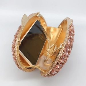 Champagne pink rhinestone evening clutch with gold metal frame and interior phone capacity