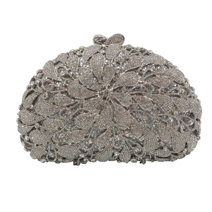 Detailed macro of silver evening clutch with rhinestones and flower petal pattern