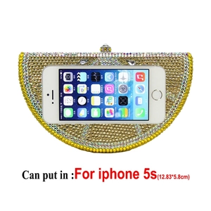 Lemon clutch with yellow crystals shown with phone inside for size comparison