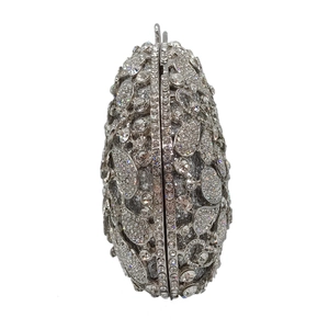 Macro shot of silver rhinestone evening clutch bag with elegant metal frame details