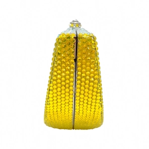 Side view of lemon yellow rhinestone evening clutch featuring silver metal frame and clasp