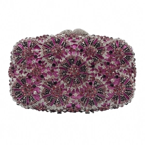 Detail of purple and pink rhinestone evening clutch with floral geometric patterns