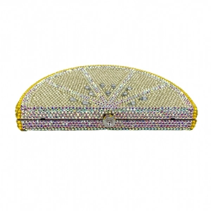 Detail of lemon slice evening clutch with sparkling crystals and silver metal clasp