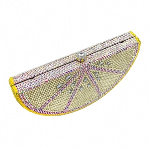 Close-up of a lemon slice shaped evening clutch bag with sparkling yellow crystal rhinestones