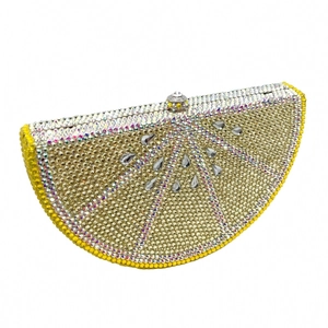 Macro detail of the lemon-shaped evening bag with sparkling silver and yellow rhinestones