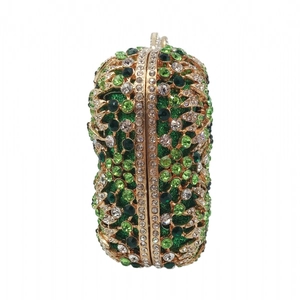 Detailed close-up of hollow gourd shaped evening clutch with green crystal rhinestones